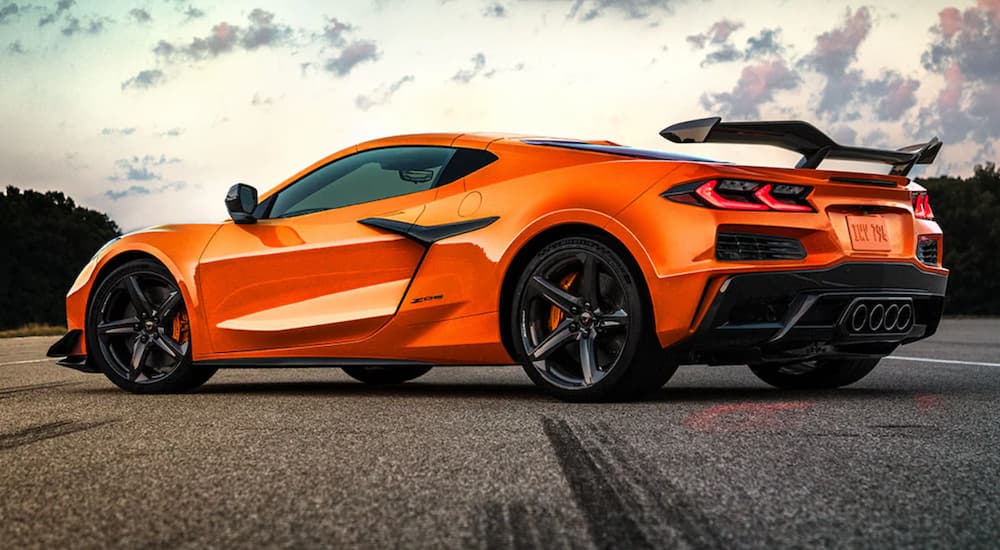 Orange 2023 Chevy Corvette Z06 is shown parked on a track