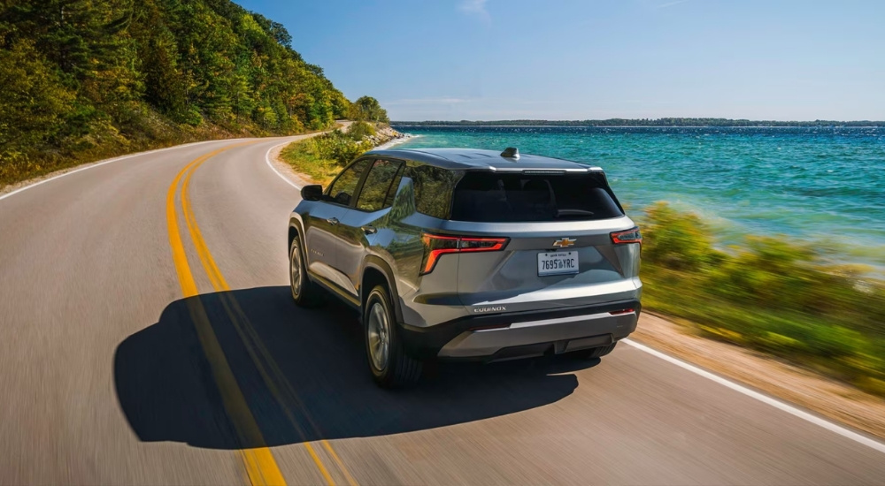 Silver 2026 Chevy Equinox for sale near Vestavia Hills driving on a highway