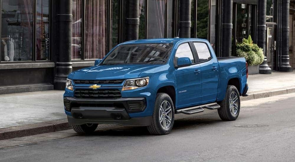 A blue 2022 Chevy Colorado is shown parked after viewing "used trucks for sale near me."