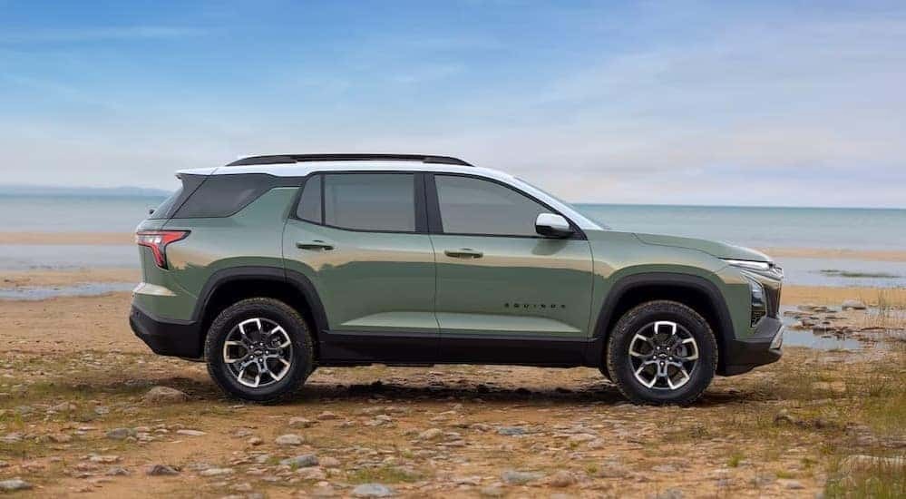 A green 2025 Chevy Equinox is shown parked off-road after viewing SUVs for sale.