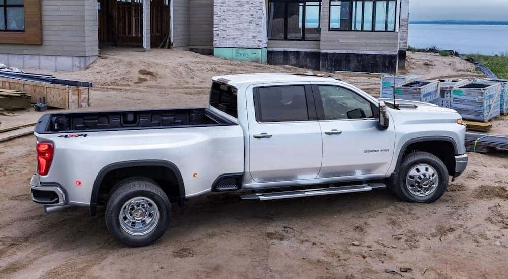 A white 2026 Chevy Silverado 3500 HD parked at a jobsite