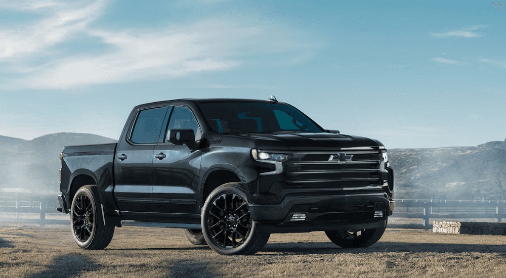 Black 2025 Chevy Silverado 1500 High Country parked at an angle for sale.