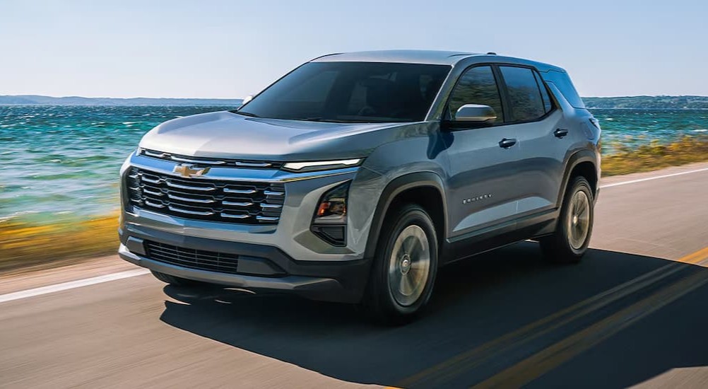 A silver 2026 Chevy Equinox driving on a highway.