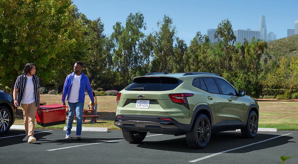 Rear of a green 2026 Chevy Trax ACTIV parked on a parking lot.