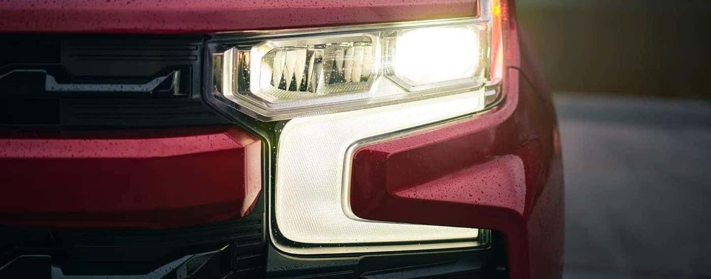 Driver side headlight on red 2022 Chevy Silverado 1500.
