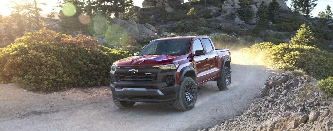 A red 2023 Chevy Colorado Trail Boss is shown from the front at an angle