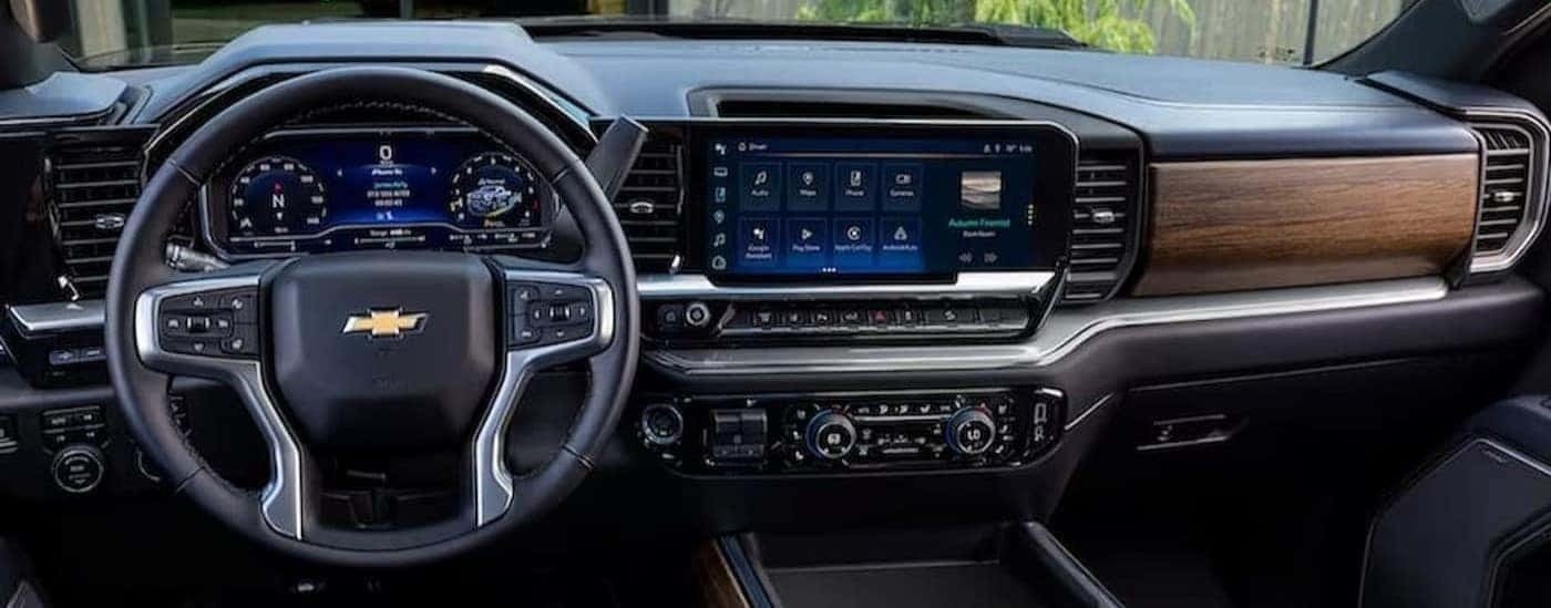 The black interior and dash in a 2023 Chevy Silverado 2500HD is shown.
