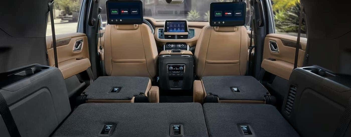 The brown and black interior and dash in a 2024 Chevy Suburban is shown.