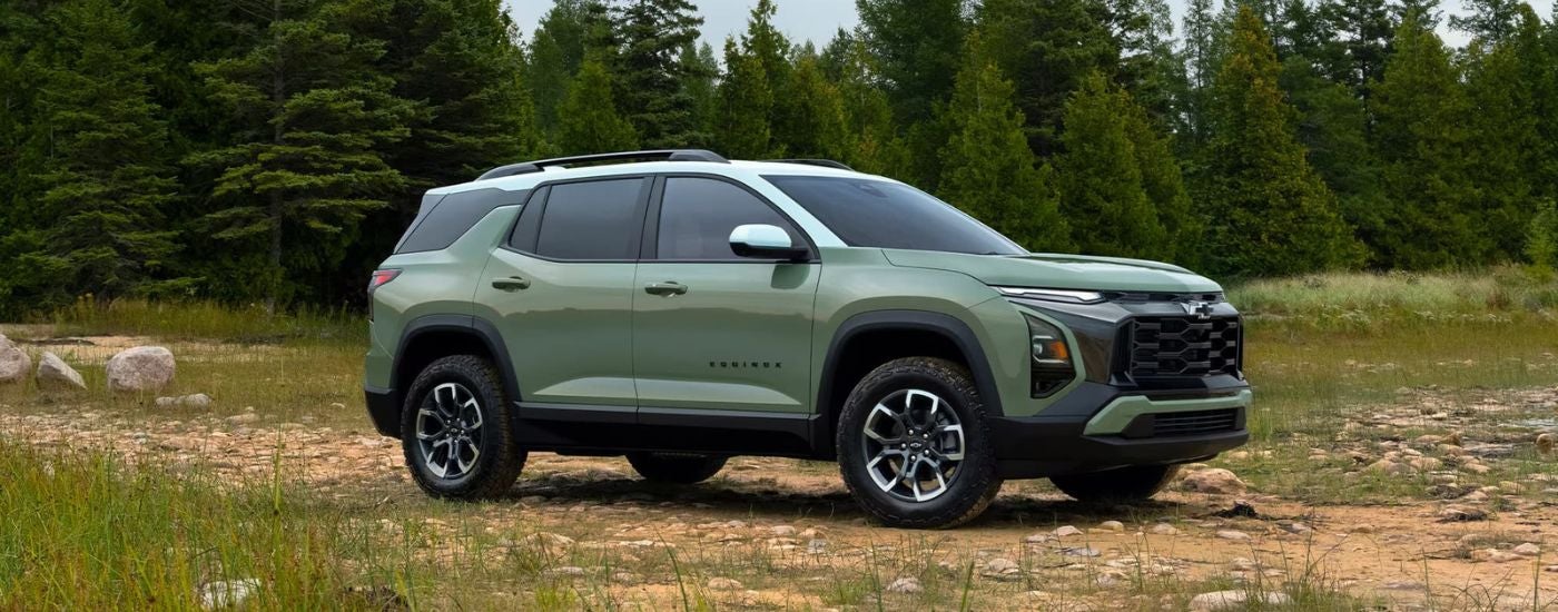 A green 2025 Chevy Equinox ACTIV from the side.