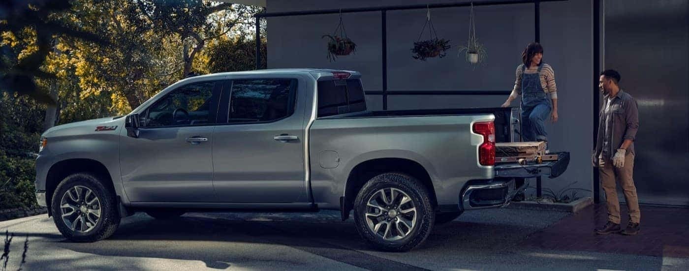 A silver 2025 Chevy Silverado 1500 for sale parked on a driveway.