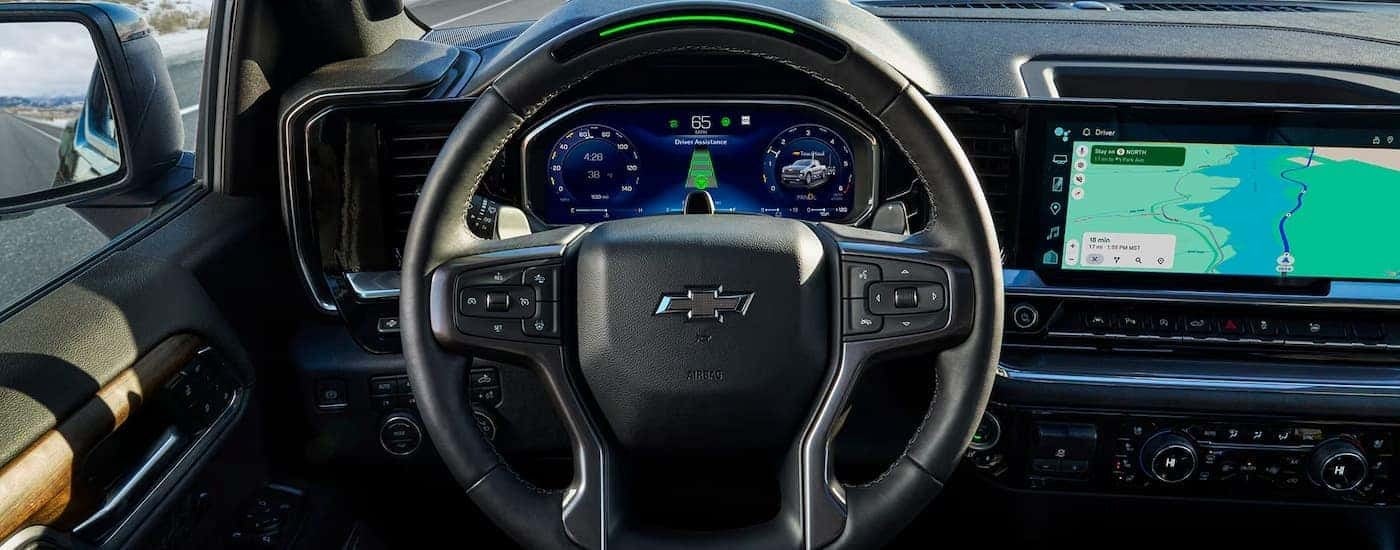 Steering wheel and infotainment screen in a 2026 Chevy Silverado 1500