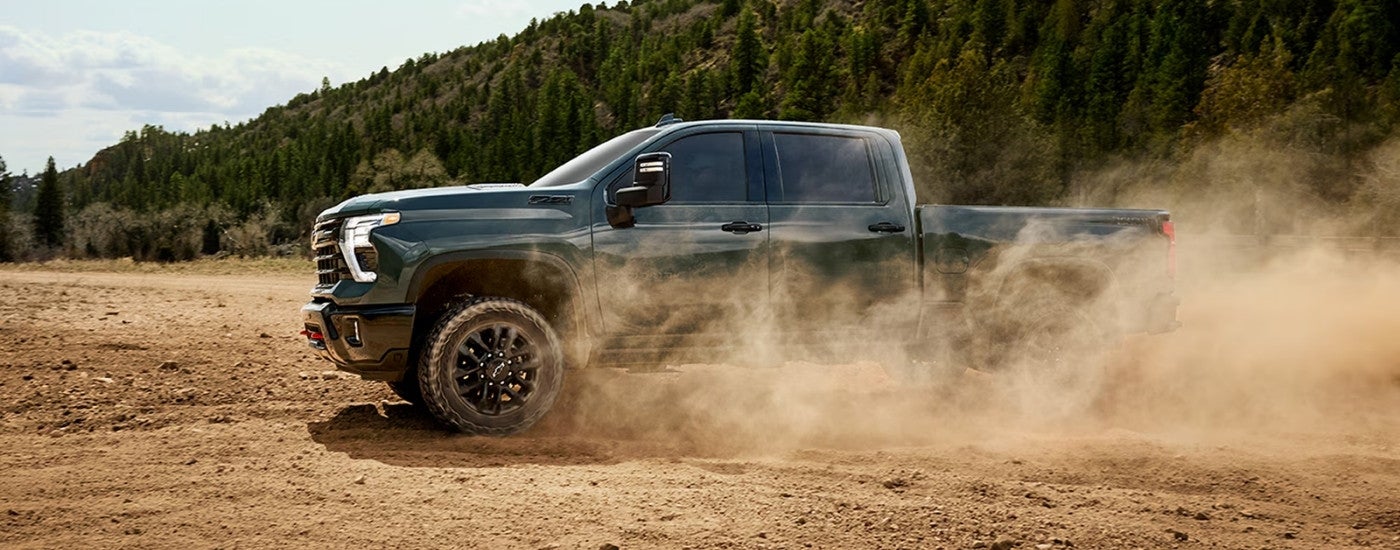 Green 2026 Chevy Silverado 2500 HD LTZ Trail Boss off-roading