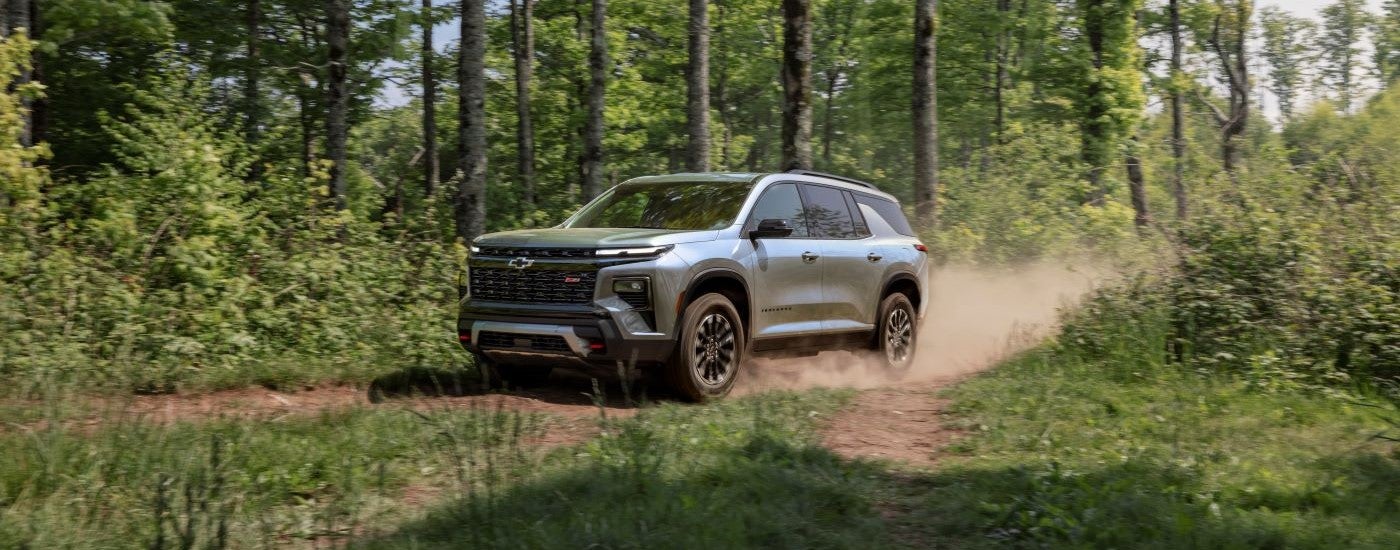 Silver 2026 Chevy Traverse Z71 driving on a trail