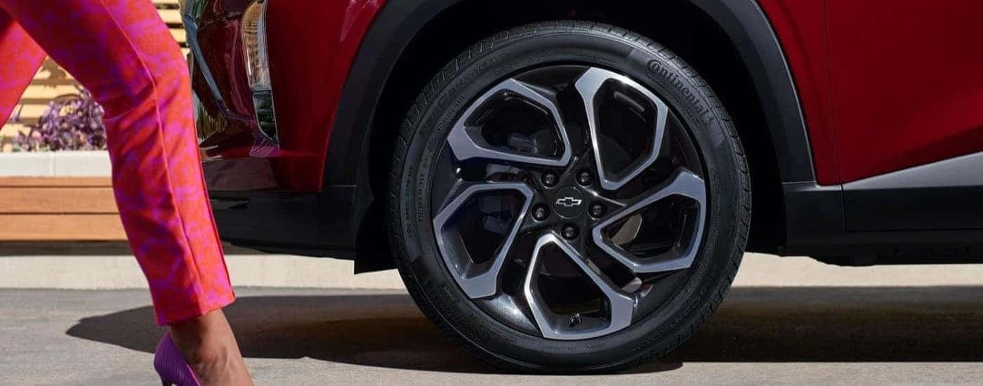 Close-up on the wheel of a red 2024 Chevy Trax RS.
