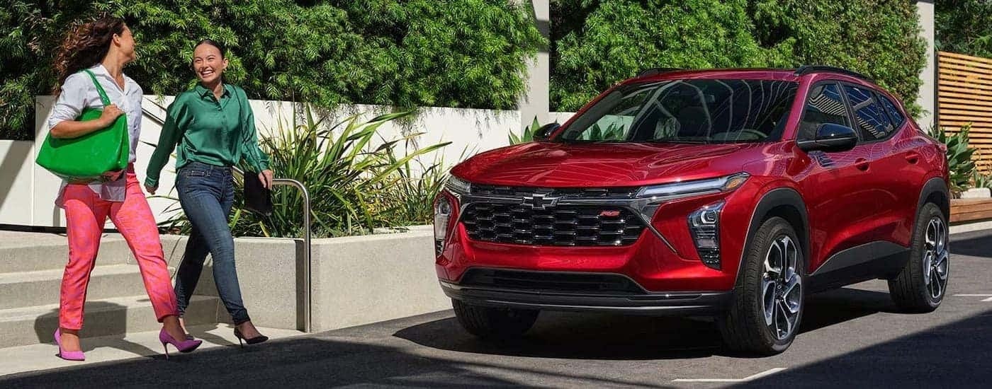 Red 2024 Chevy Trax RS for sale parked by a curb