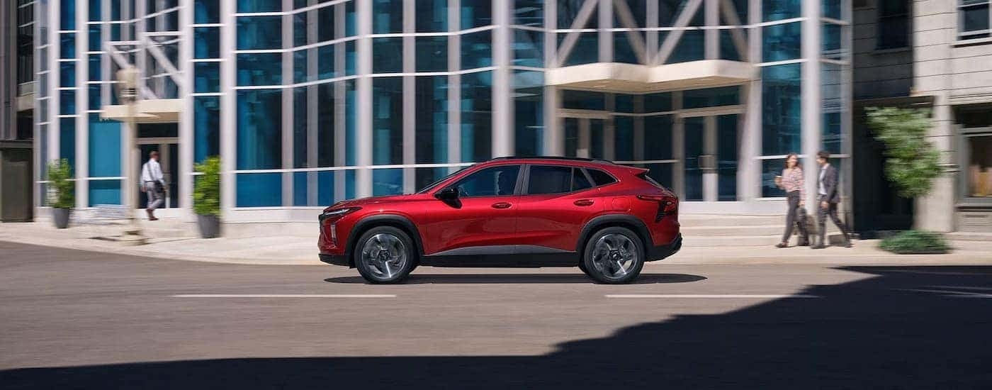 Red 2025 Chevy Trax RS driving down a road