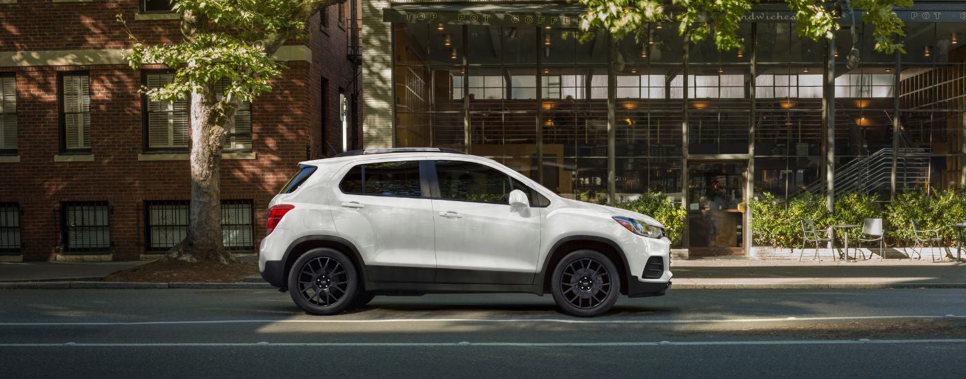 White 2021 Chevy Trax parked in front of a building